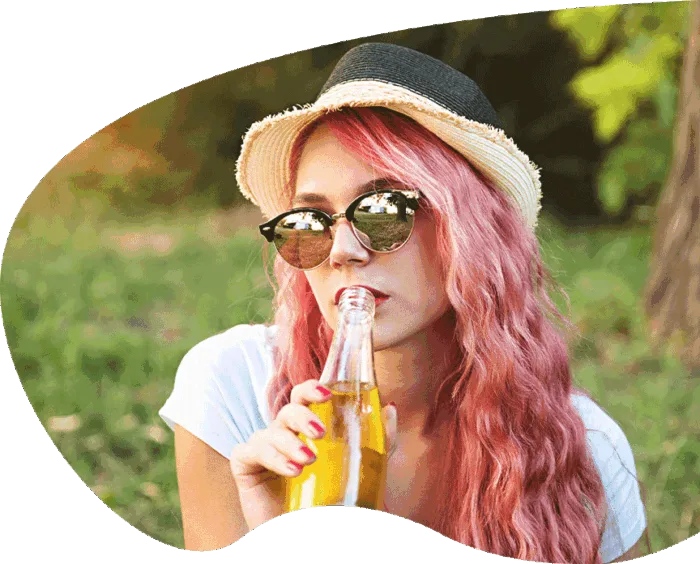girl drinking yellow soda